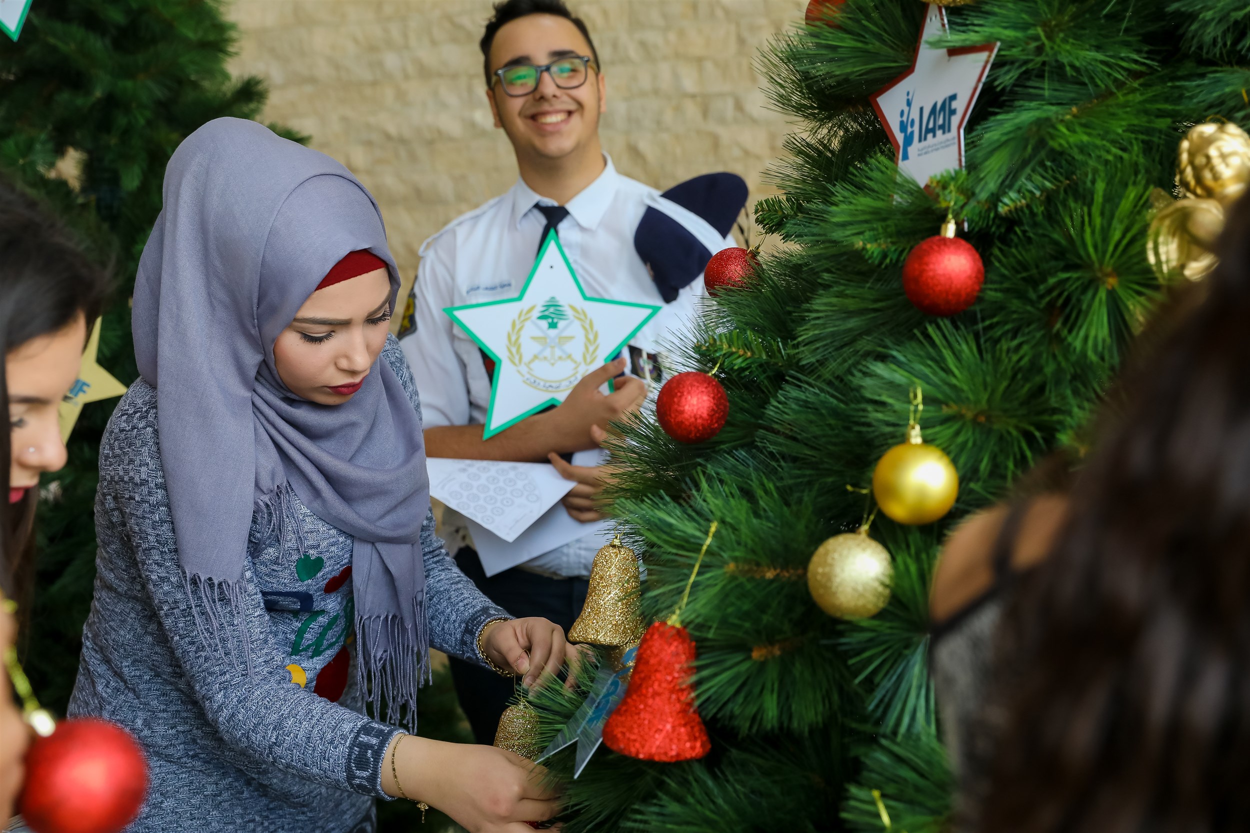 a warm welcome to the children of our lebanese army decorating their tree in the christmas lunch in bkerke